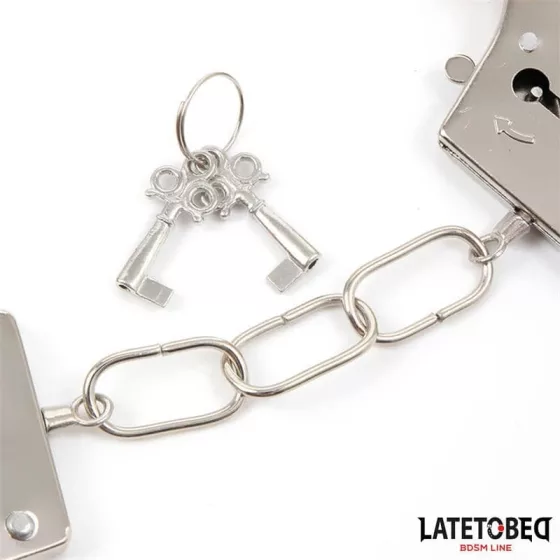 LateToBed – fém csuklóbilincs fekete plüsshuzattal "B" kategória
